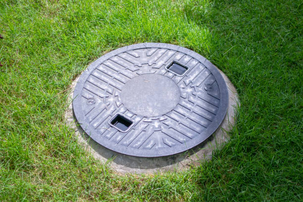 Septic tank cover underground waste treatment system stock photo