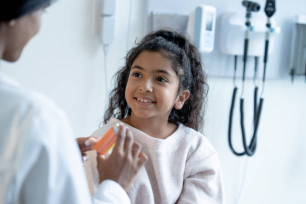 istock Young Patient Watching Doctor Explain How to Use an Inhaler 1356463623