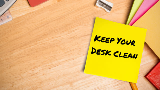 Animation of keep your desk clean text on memo note on desk