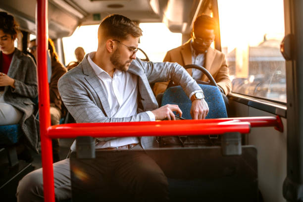 istock Young businessman traveling by bus 1356465079