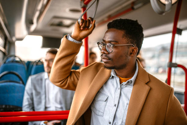istock Young businessman traveling by bus 1356465089