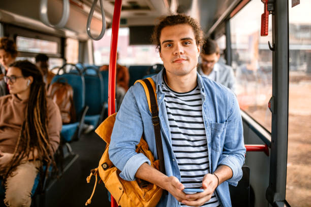 young tourist riding in bus - bus riding public transportation businessman imagens e fotografias de stock