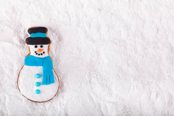 istock Christmas Gingerbread snowmen on the snow 1356466590