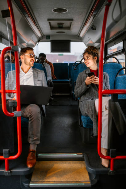 istock Friends travel by bus after work 1356466696