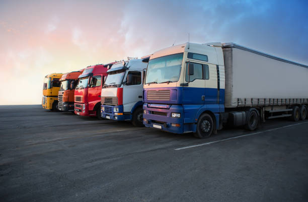 istock Trucks in a row in the parking lot 1356475672