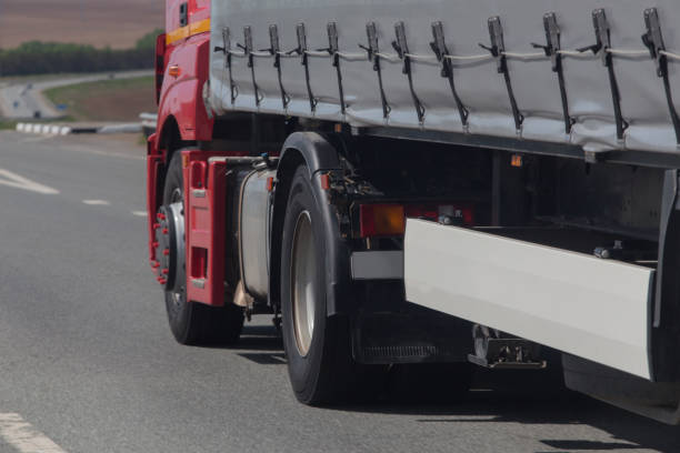 istock large truck moves along the road. 1356475721