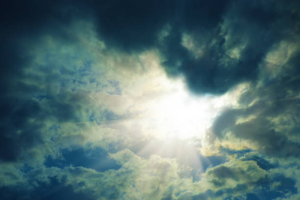 istock Bright sun in a beautiful cloudy sky. 1356475883