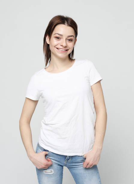 istock good looking young woman smiles positively 1356476393