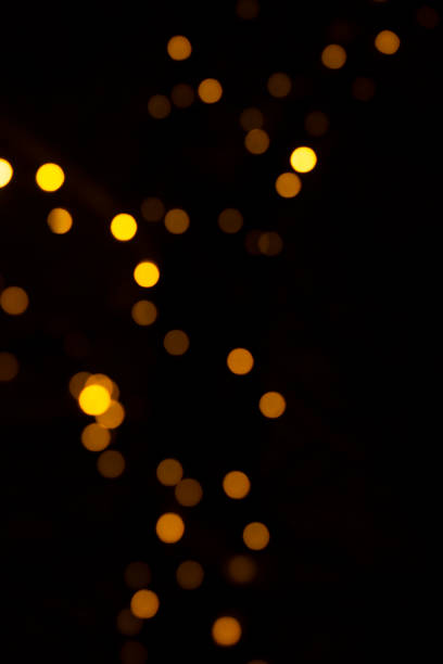 istock Sparkles multicolored shining on a dark background. Template for creative holiday design 1356476432