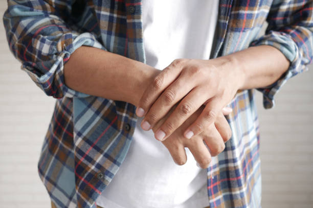 istock man suffering pain in hand close up 1356477017