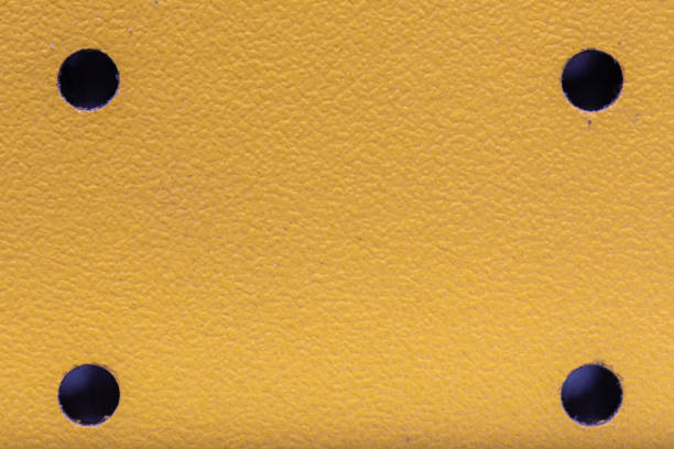 istock yellow leather texture background with perforation or holes 1356482256