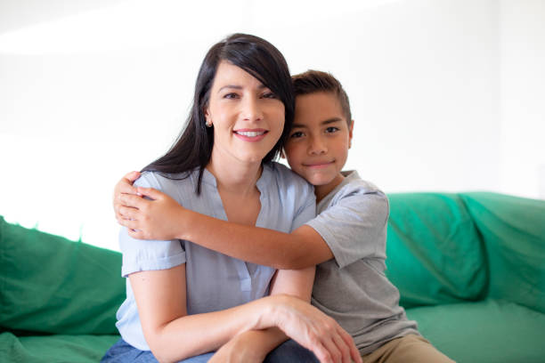 istock mother and son on couch spending time together 1356491443