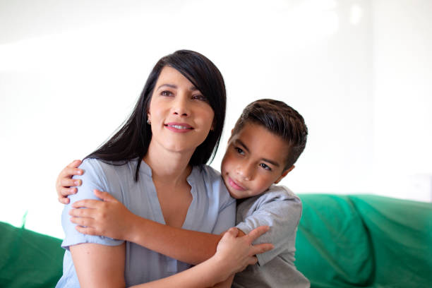 istock mother and son on couch spending time together 1356491444