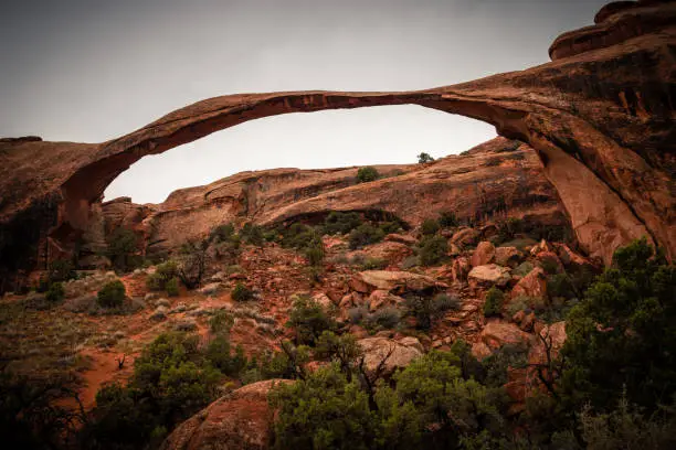 View of Landscape Arch, storm clouds in the sky, Arches National Park, Utah, USA