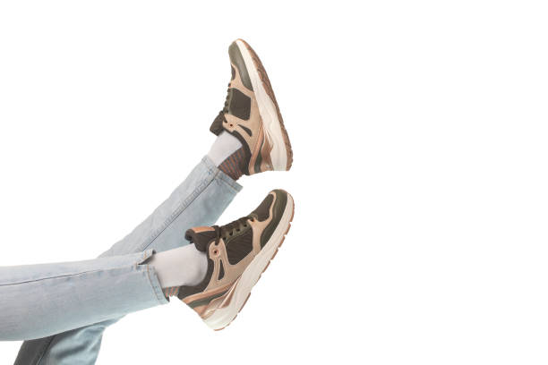 istock Legs shod in sneakers. 1356499209