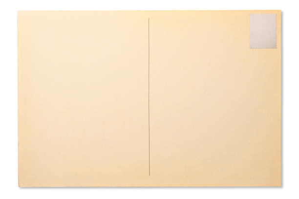 istock Isolated shot of old blank postcard with blank postage stamp on white background 1356500688
