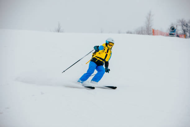 istock woman skier at ski slope 1356502602