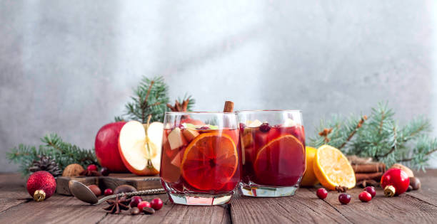 Sangria with Apple, cranberry and orange Sangria with Apple, cranberry and orange for Christmas table sangria stock pictures, royalty-free photos & images