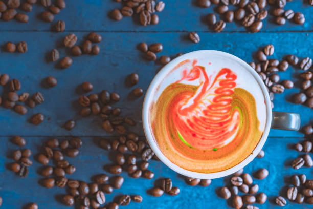 coffee latte art roasted coffee beans flat lay on wood table, relax time, cafe barista art top view.