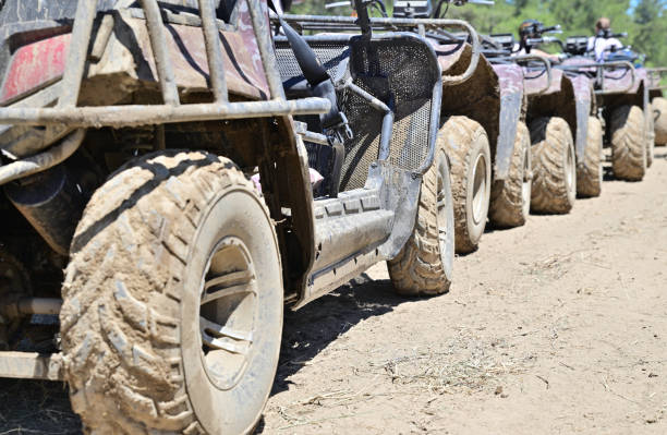 istock The buggy wheels are covered with a thick layer of mud 1356513502