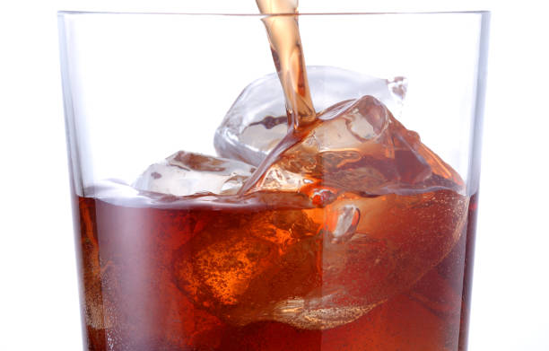 istock Macro shot of glass with sod a drink and ice cubes 1356520005