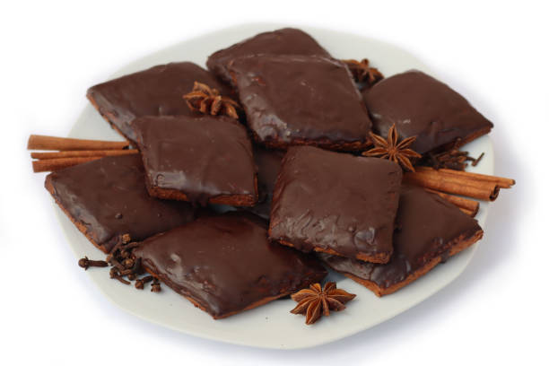istock Italian traditional festive cookies called Mostaccioli or Mustaccioli on a plate on white 1356521506