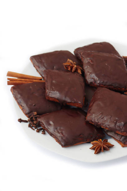 istock Italian traditional festive cookies called Mostaccioli or Mustaccioli on a plate on white 1356521540