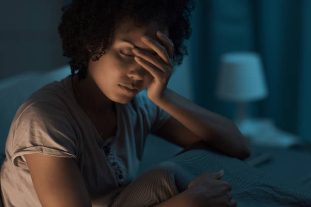 istock Depressed woman suffering from insomnia 1356523514