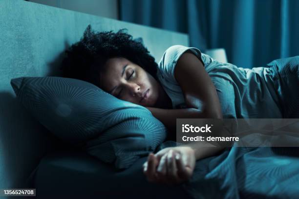 African American Woman Sleeping In Her Bed Stock Photo - Download Image Now - Sleeping, Women, One Woman Only