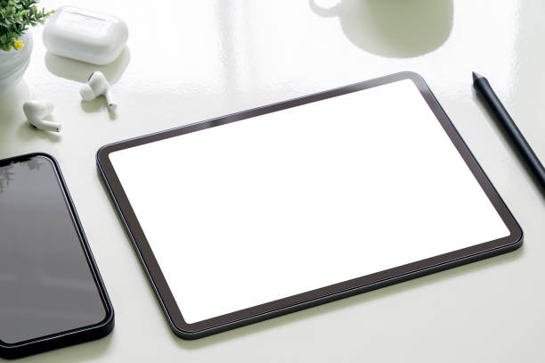 istock Mockup blank screen portable tablet and smartphone on white top table. 1356525044
