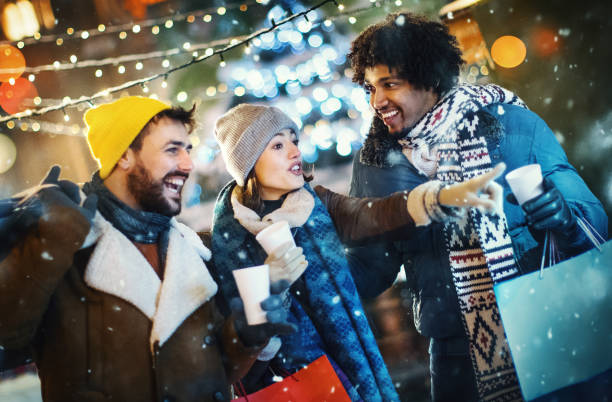istock Friends taking a break during Christmas eve shopping. 1356526293