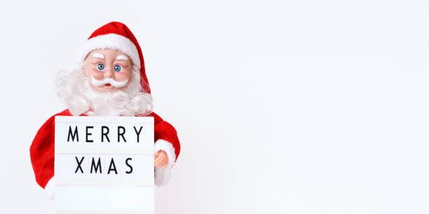 istock Santa Claus with lightbox on white background. Text Merry Xmas. Front view. Banner. Copy space 1356526534