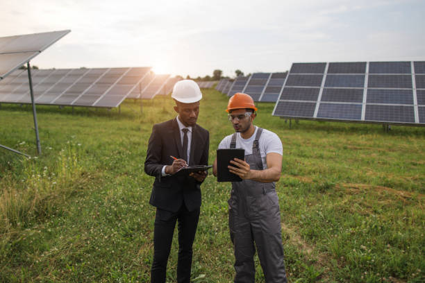 istock Two multiracial men examining solar panels outdoors 1356527855