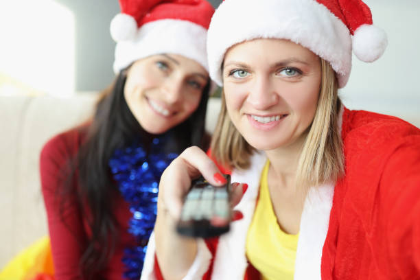 istock Friends holding remote control and switch to next year 1356529200