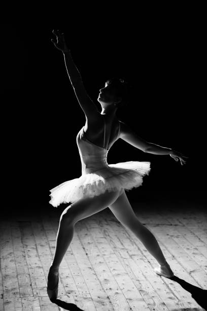 istock Young beautiful ballerina posing on stage 1356530589