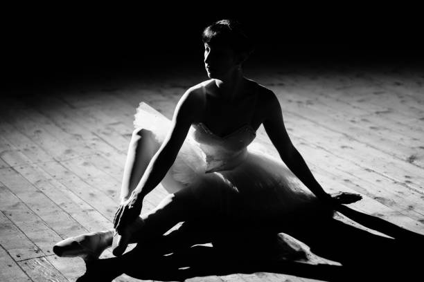 istock Young beautiful ballerina posing on stage 1356530591