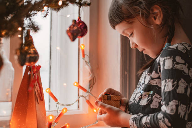 istock Five Year Old Girl Enjoying Christmas 1356530783