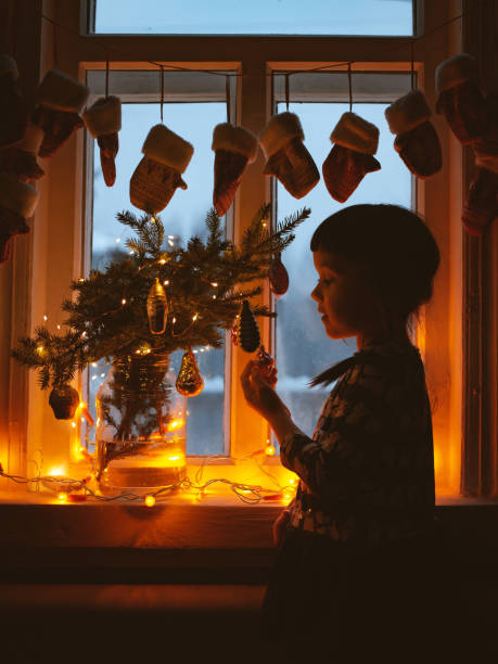 five year old girl enjoying christmas - children tree christmas silhouette bildbanksfoton och bilder