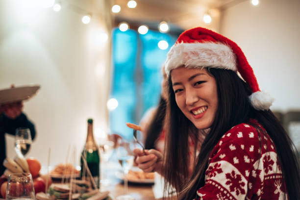 istock friends toasting at christmas dinner 1356532237