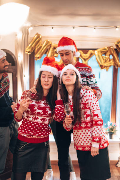 istock friends having fun at home for christmas 1356532538