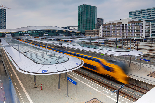 Utrecht, Netherlands - March 23, 2021; departing train at Utrecht Central Station, Located in the center of the country Utrecht Central Station is an important transit hub