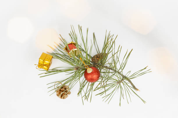 istock Christmas flat lay styled scene - top view frame with evergreen tree twigs and christmas decorations 1356533717