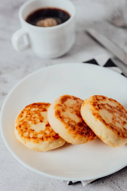 istock Cottage cheese cheesecakes on a wooden board 1356534828