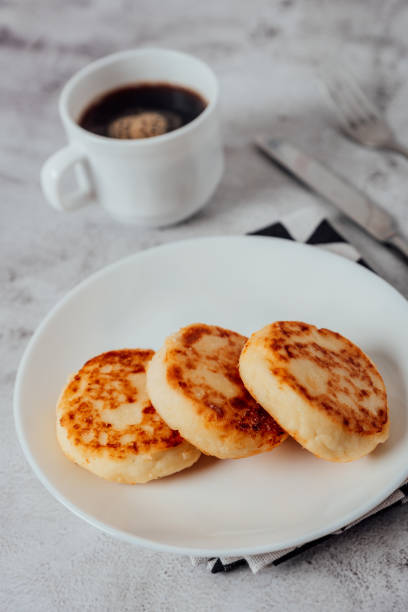 istock Cottage cheese cheesecakes on a wooden board 1356534856