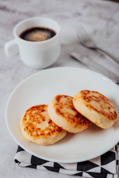 istock Cottage cheese cheesecakes on a wooden board 1356534891