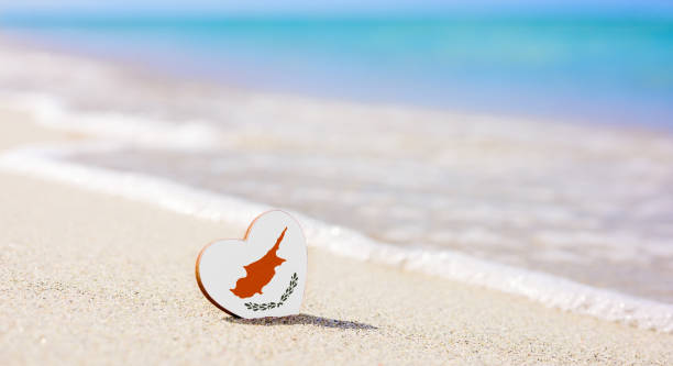 Flag of Cyprus in the shape of a heart on a sandy beach. Flag of Cyprus in the shape of a heart on a sandy beach. The concept of the best vacation in Cyprus cyprus agia napa stock pictures, royalty-free photos & images