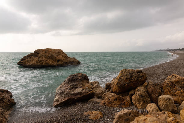 istock Amazing seascape and rocky beach 1356537920