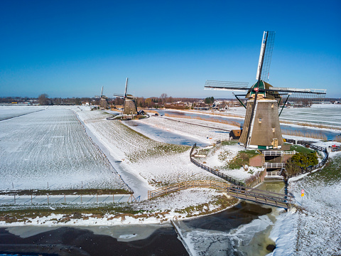 aerial view on The Molendriegang Drie Molens in the vicinity of the Dutch city of The Hague, a mill corridor consisting of three windmills. The mills were built around 1672 for the reclamation of De Driemanspolder.