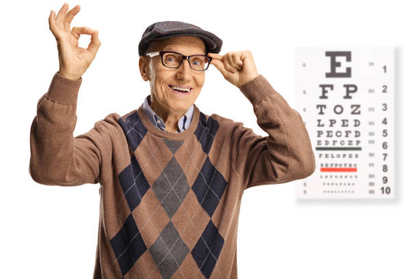 istock Happy senior man with glasses and an eye examination test 1356538896