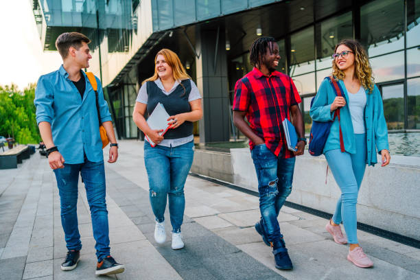 istock Friends walking to university 1356540139